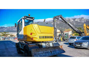 Pelle sur pneus Liebherr A910: photos 5