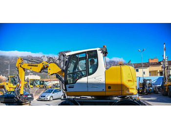 Pelle sur pneus Liebherr A910: photos 3