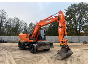 Pelle sur pneus DOOSAN DX140W-3