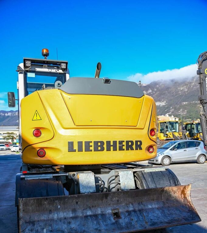 Pelle sur pneus Liebherr A910: photos 6